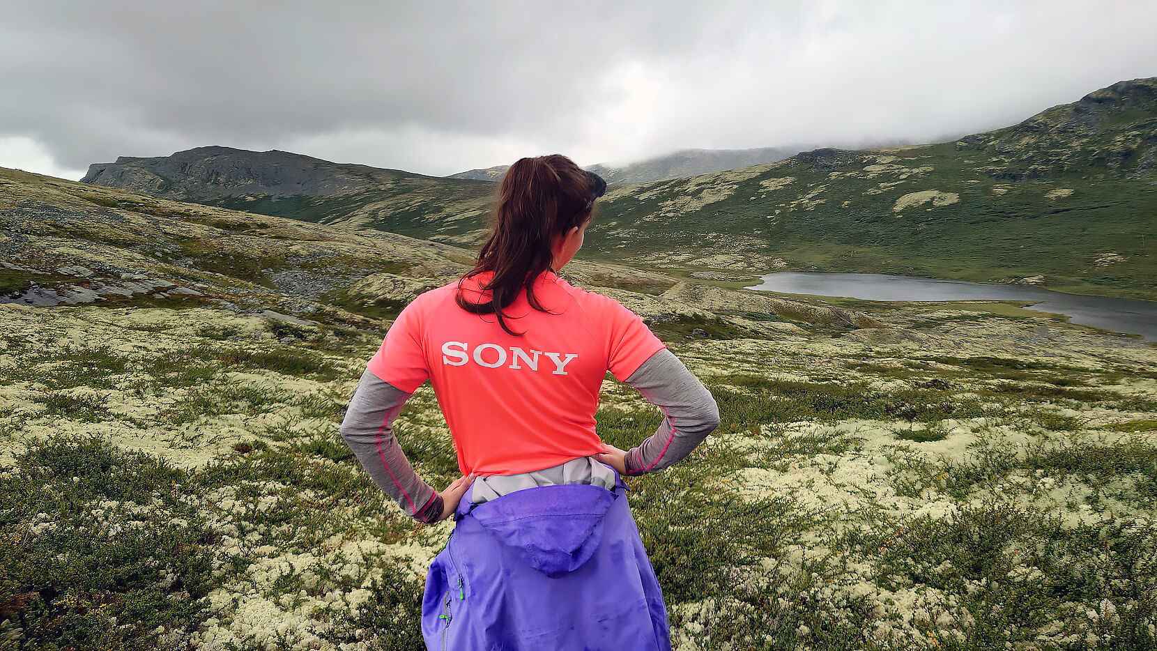 Group photo showing three Sony employees chatting over coffee